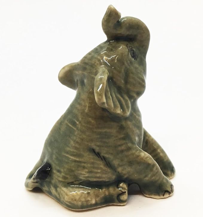 ChangThai Design Tiny 1⅜" Gray Baby Elephant Sitting Look Up Figurine - Miniature Hand Made Painted Ceramic Asian Elephants Cute Wildlife Animals Porcelain Decorative Collectible Figures Décor Gifts