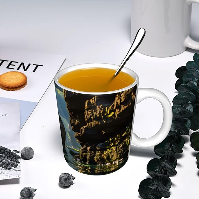 This Asian elephant in the water ceramic coffee mug features a classic design, making it perfect for home, office, and cafe use.